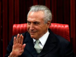 Brazil's interim President Michel Temer gestures during the inauguration ceremony of Gilmar Mendes (not in the picture) as the new president of the Superior Electoral Court in Brasilia, Brazil, May 12, 2016. REUTERS/Paulo Whitaker